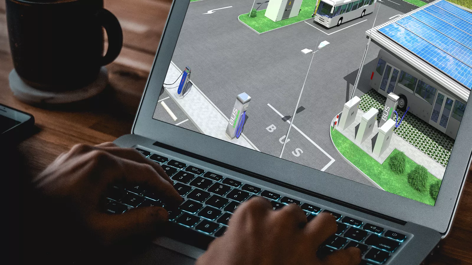 Laptop-Bildschirm, auf dem ein digitaler Entwurf einer Ladestation für Elektrobusse mit Solarzellen angezeigt wird.